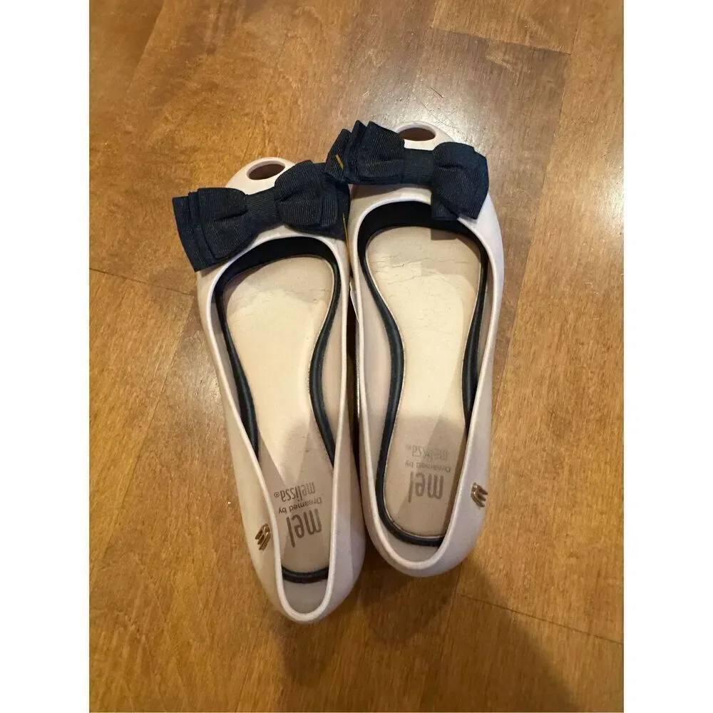 Little girl size one Melissa flats size one